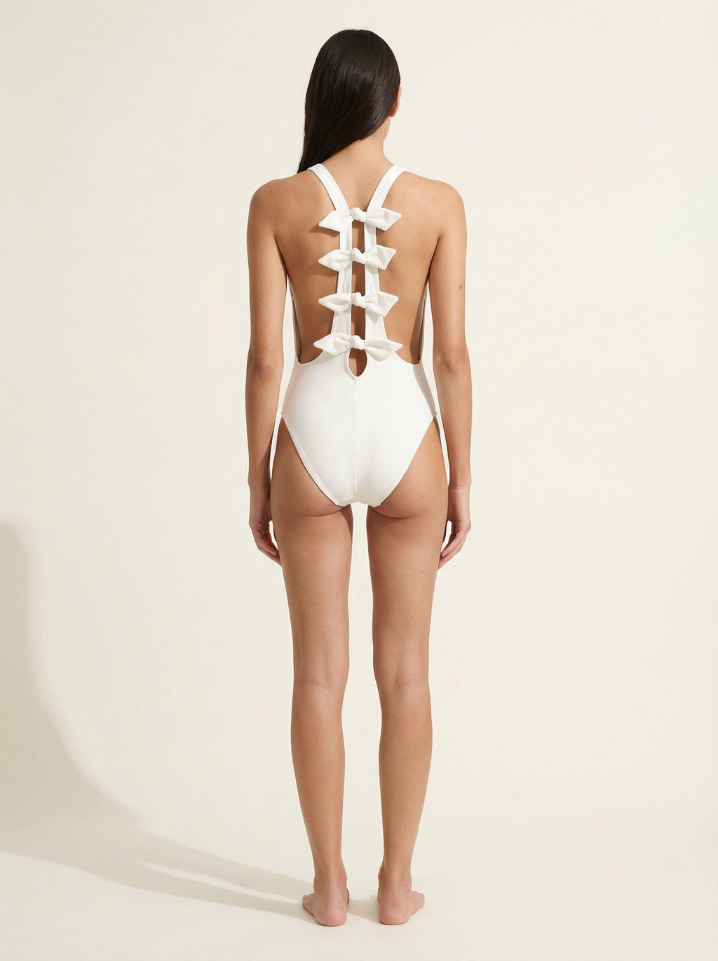 The Arabella — Bow-Spine Open Back One-Piece - 08-model-back-view-approved